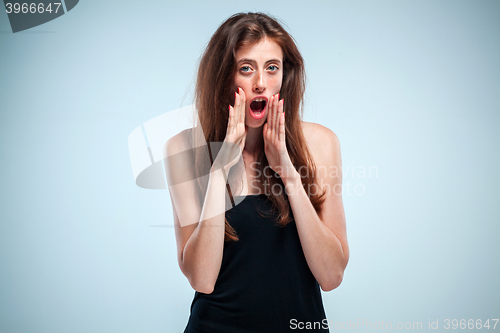 Image of The young woman telling a secret