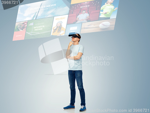 Image of happy man in virtual reality headset or 3d glasses