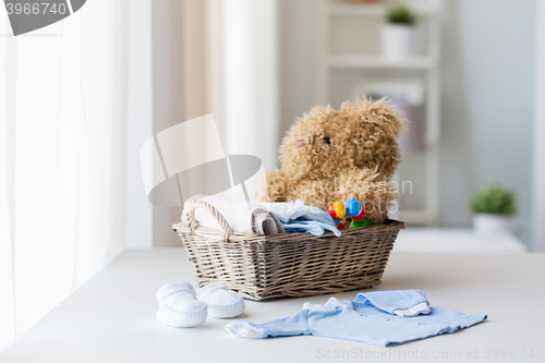 Image of close up of baby clothes and toys for newborn