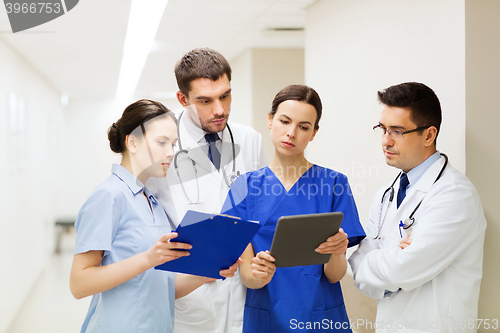Image of group of medics with clipboards at hospital