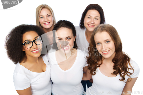 Image of group of happy different women in white t-shirts