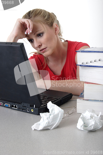 Image of Girl doing homework on laptop