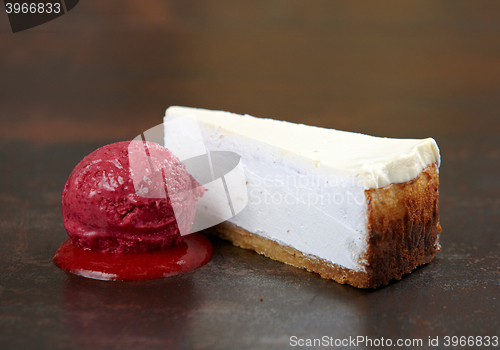 Image of fresh cheesecake with sorbet ball