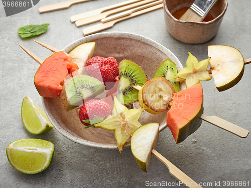 Image of fresh berries and fruit pieces on skewers