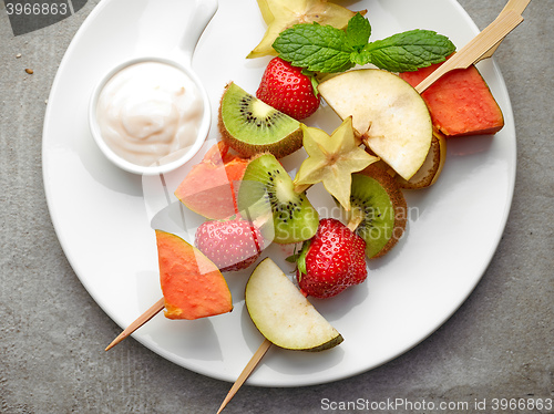 Image of fresh berries and fruit pieces on skewers