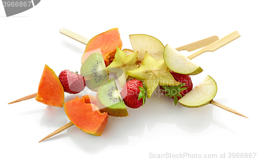 Image of fresh berries and fruit pieces on skewers