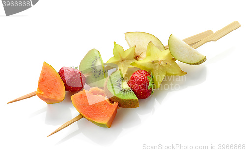 Image of fresh berries and fruit pieces on skewers