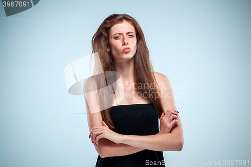 Image of The thoughtful woman on gray background