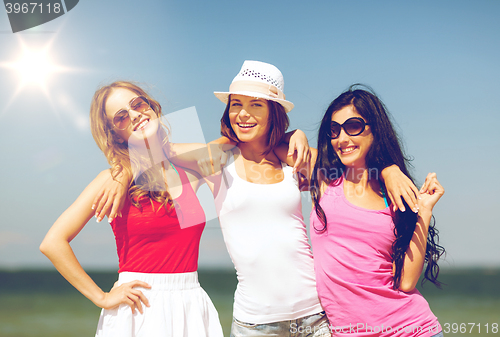 Image of group of girls chilling on the beach