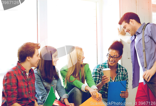 Image of students communicating and laughing at school