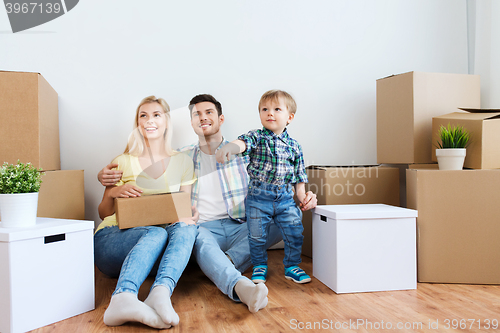 Image of happy family with boxes moving to new home