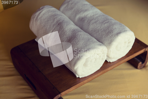 Image of rolled bath towels at hotel spa