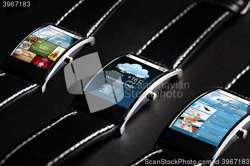 Image of close up of black smart watch set with multimedia