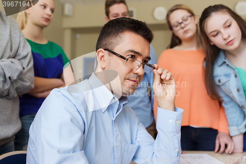 Image of group of students and teacher at school classroom