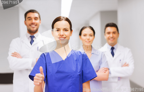 Image of medics or doctors at hospital showing thumbs up