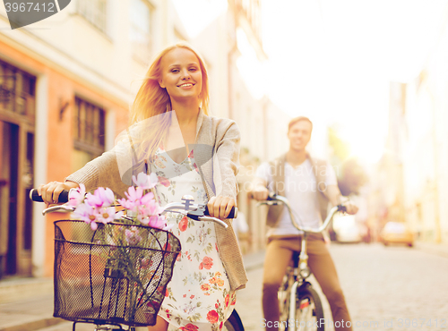 Image of couple with bicycles in the city