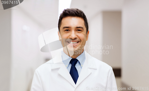 Image of smiling doctor in white coat at hospital