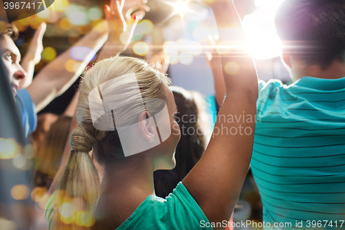 Image of close up of happy people at concert in night club