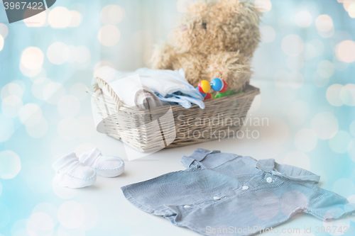 Image of close up of baby clothes and toys for newborn