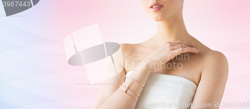 Image of close up of beautiful woman with ring and bracelet