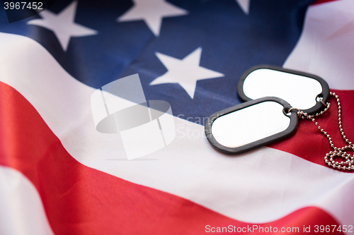 Image of close up of american flag and military badges