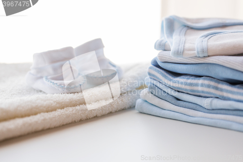 Image of close up of baby boys clothes for newborn on table