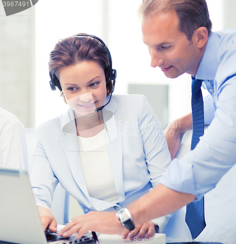 Image of group of people working in call center