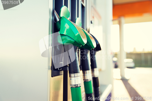 Image of close up of gasoline hose at gas station