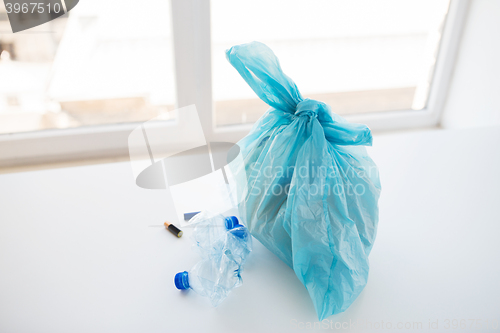 Image of close up of rubbish bag with trash at home