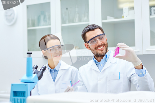 Image of young scientists making test or research in lab