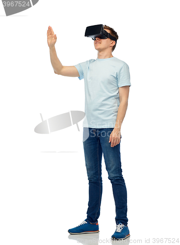 Image of happy man in virtual reality headset or 3d glasses