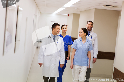 Image of group of happy medics or doctors at hospital