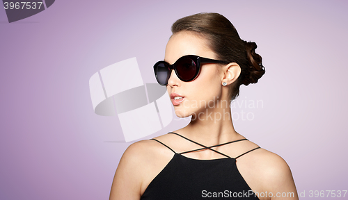 Image of beautiful young woman in elegant black sunglasses