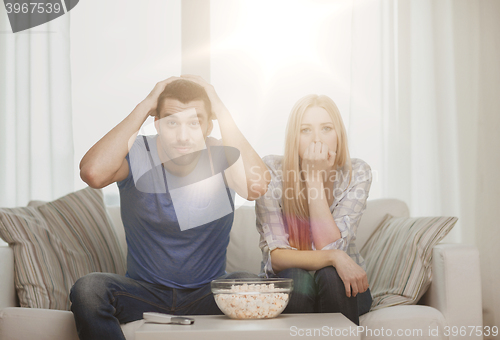 Image of upset couple after sports team loss