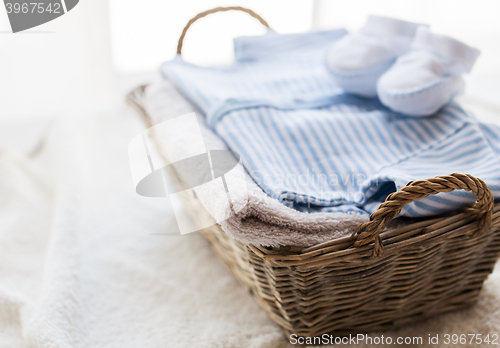 Image of close up of baby clothes for newborn boy in basket