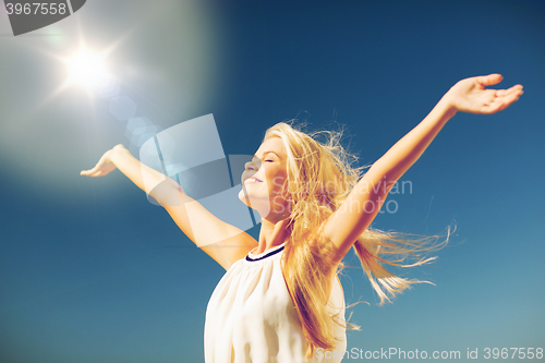 Image of beautiful woman enjoying summer outdoors