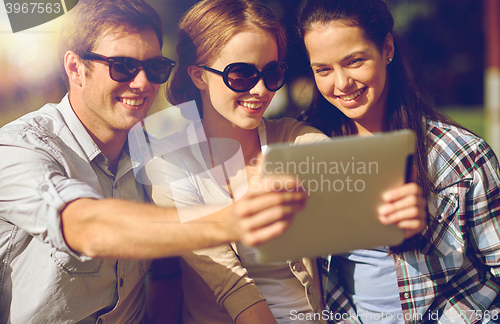 Image of students or teenagers with tablet pc taking selfie