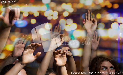 Image of close up of happy people at concert in night club