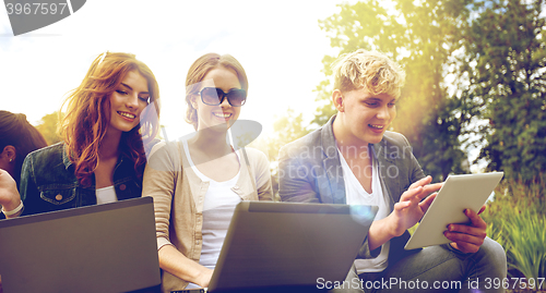 Image of students or teenagers with laptop computers