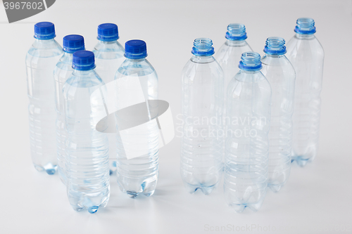 Image of close up of bottles with drinking water on table