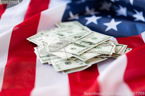 Image of close up of american flag and dollar cash money