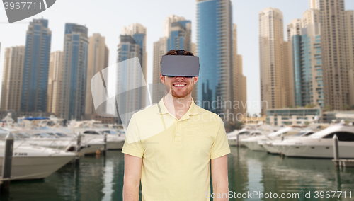 Image of happy man in virtual reality headset or 3d glasses