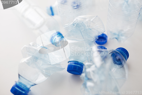 Image of close up of empty used plastic bottles on table