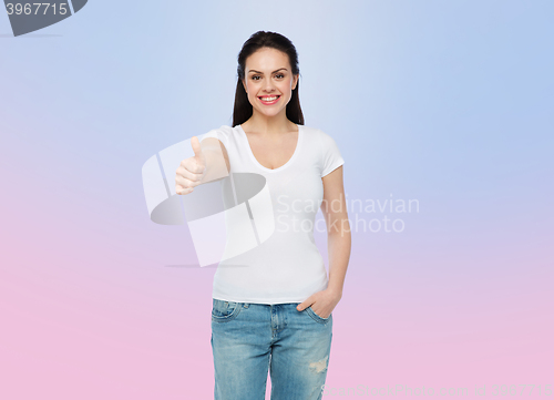 Image of happy womanin white t-shirt showing thumbs up