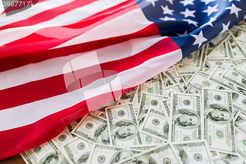 Image of close up of american flag and dollar cash money