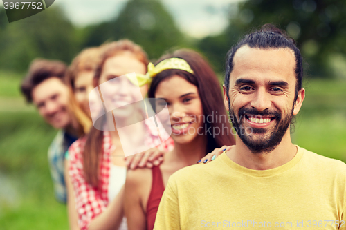 Image of group of smiling friends outdoors