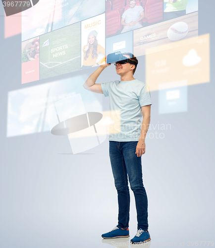 Image of happy man in virtual reality headset or 3d glasses