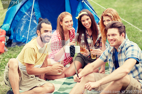 Image of happy friends taking selfie by smartphone at camp