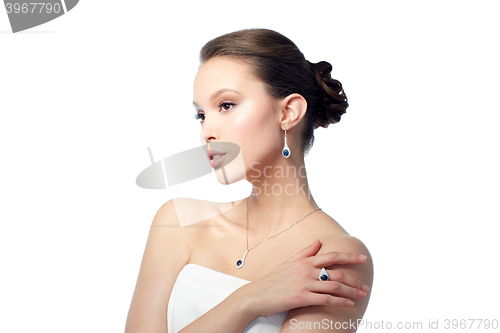 Image of beautiful woman with earring, ring and pendant