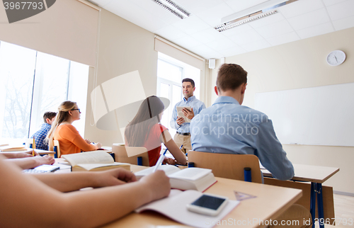 Image of students and teacher with tablet pc at school